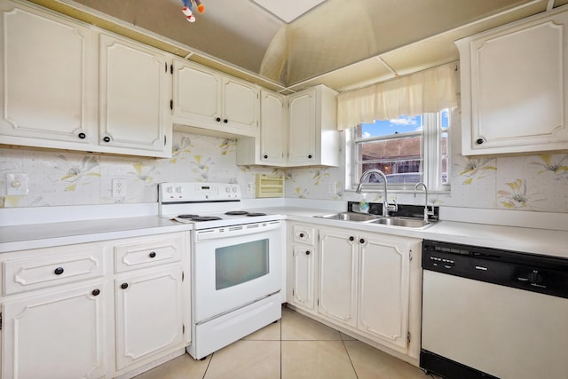 kitchen with white cabinets, light tile patterned floors, white appliances, and sink