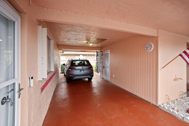 garage featuring wooden walls