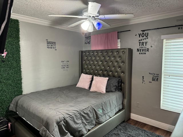 bedroom featuring ceiling fan, ornamental molding, a textured ceiling, and hardwood / wood-style flooring