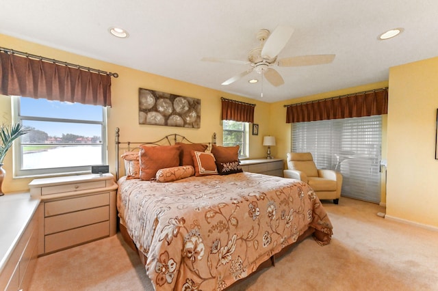 carpeted bedroom featuring ceiling fan