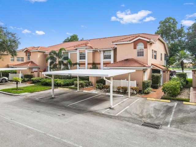 view of parking / parking lot with a carport