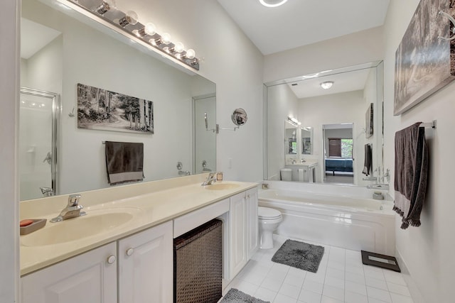 full bathroom featuring tile patterned floors, plus walk in shower, vanity, and toilet