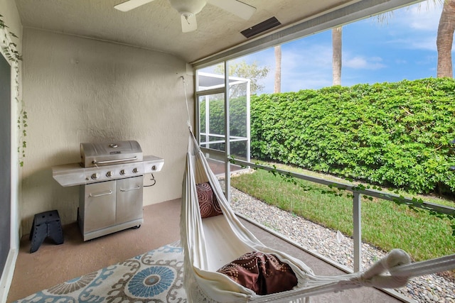 sunroom / solarium with ceiling fan