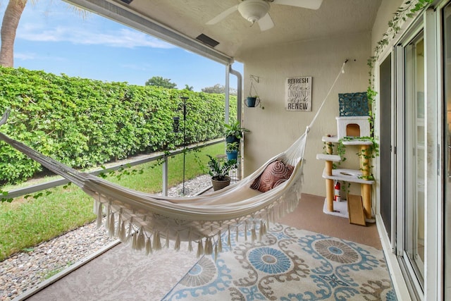 sunroom / solarium with ceiling fan