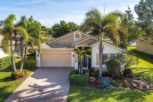 view of front of home featuring a front yard and a garage