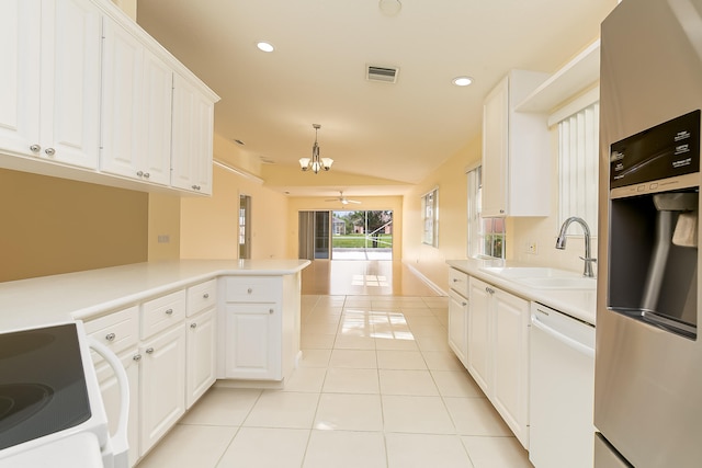 kitchen with white cabinetry, sink, kitchen peninsula, white dishwasher, and decorative light fixtures