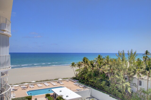 aerial view with a beach view and a water view