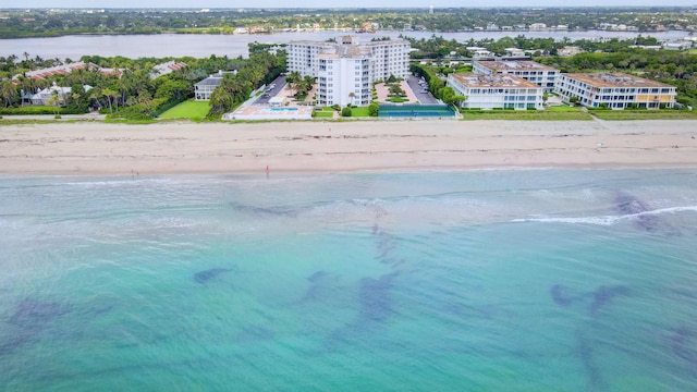 drone / aerial view featuring a view of the beach and a water view