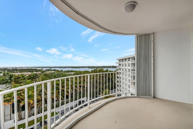 balcony featuring a water view