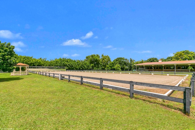 view of yard with a rural view