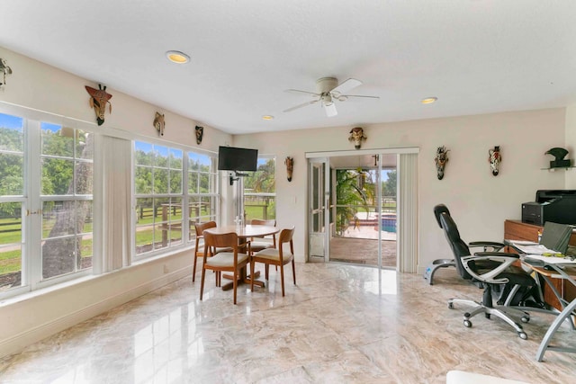 office space with ceiling fan and a wealth of natural light