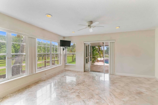 spare room featuring ceiling fan