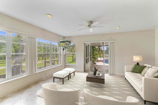 living room with ceiling fan