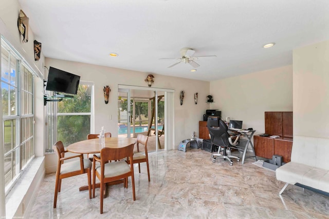 dining space featuring ceiling fan