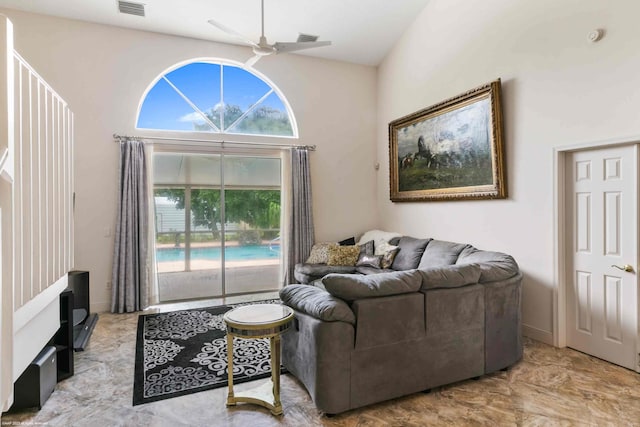 living room featuring high vaulted ceiling and ceiling fan