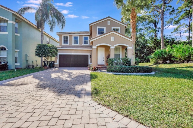 view of front of property with a garage and a front yard