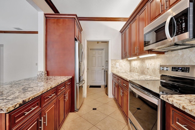 kitchen with stainless steel appliances, light stone counters, backsplash, crown molding, and light tile patterned floors