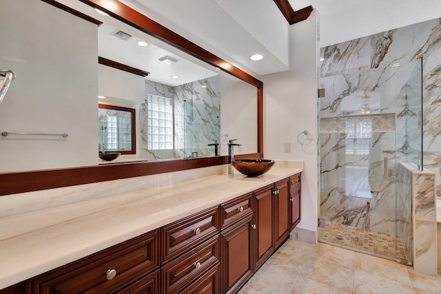 bathroom featuring vanity and a shower with shower door