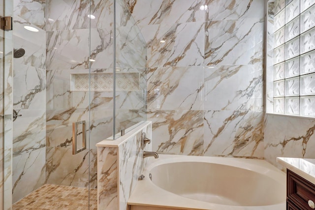 bathroom with vanity, tile walls, and plus walk in shower