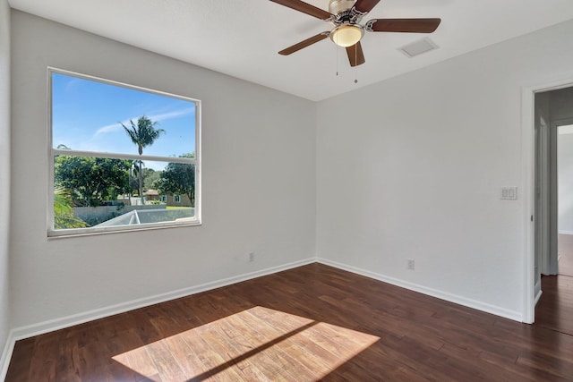 unfurnished room featuring dark hardwood / wood-style floors and ceiling fan