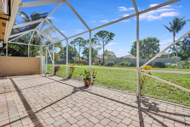 view of patio featuring a lanai