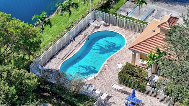 view of pool with a water view