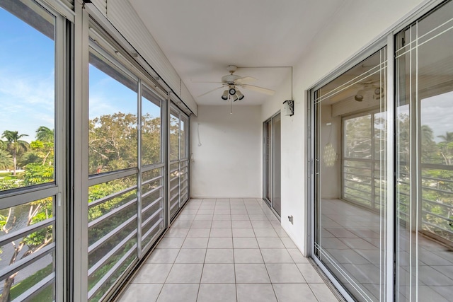 unfurnished sunroom featuring plenty of natural light and ceiling fan