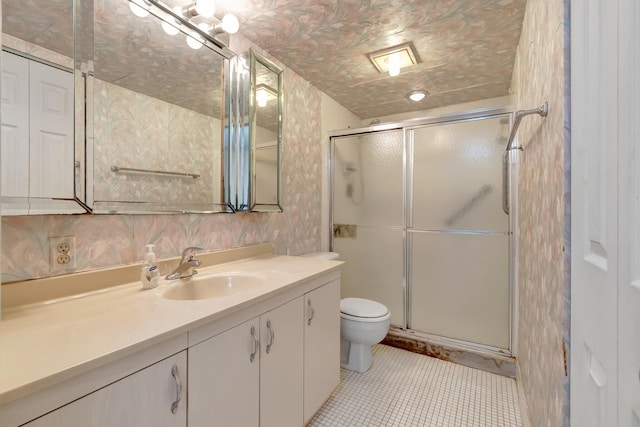 bathroom with vanity, tile patterned floors, decorative backsplash, toilet, and an enclosed shower