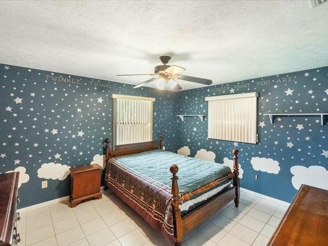 tiled bedroom featuring ceiling fan and a textured ceiling