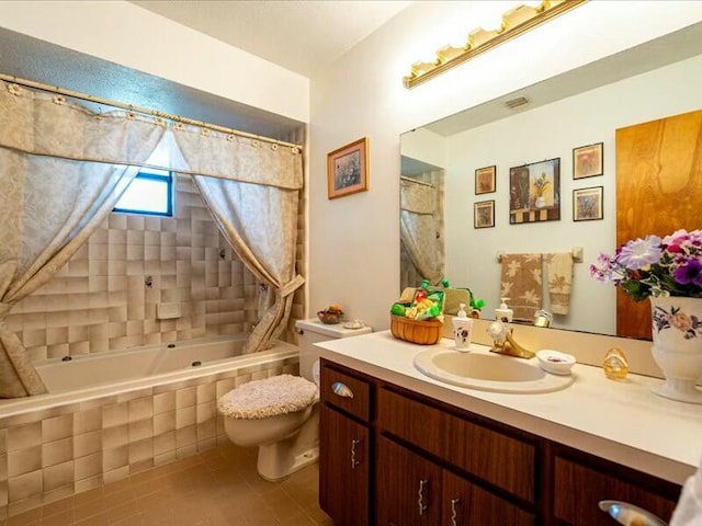 full bathroom featuring tile patterned floors, toilet, vanity, and shower / bath combo