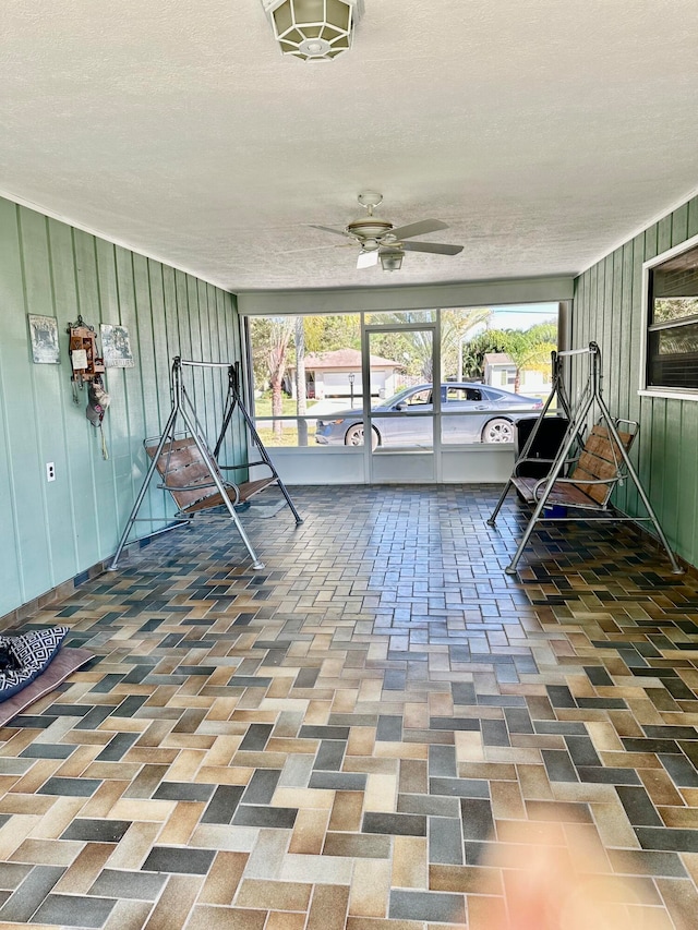 interior space featuring ceiling fan