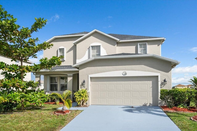 traditional home featuring stucco siding, concrete driveway, and a garage