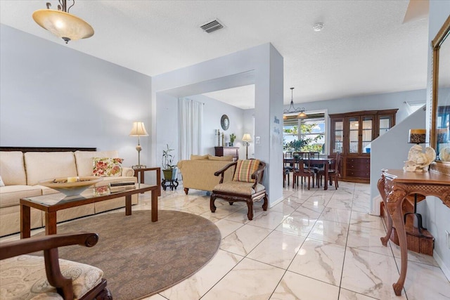 living room featuring a textured ceiling