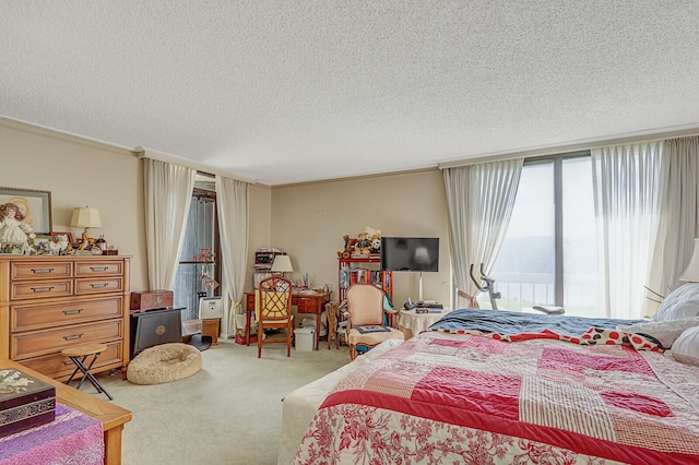 bedroom featuring crown molding, carpet, and a textured ceiling