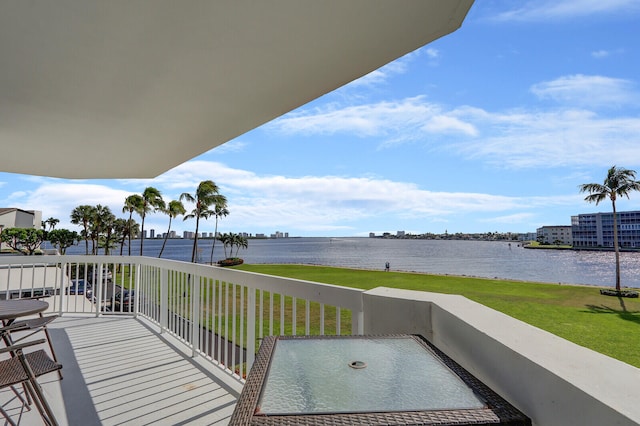 balcony featuring a water view