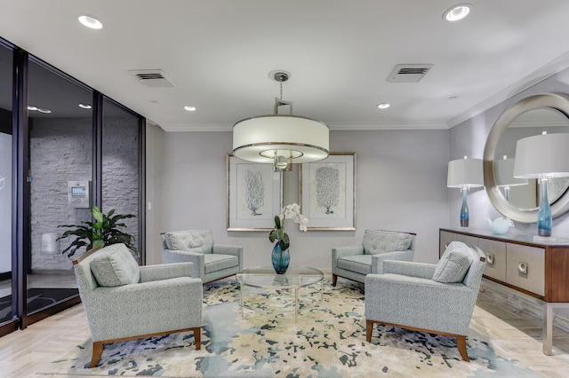 living area featuring light wood-type flooring and crown molding