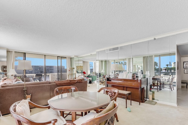 carpeted dining space featuring a textured ceiling and a wall of windows