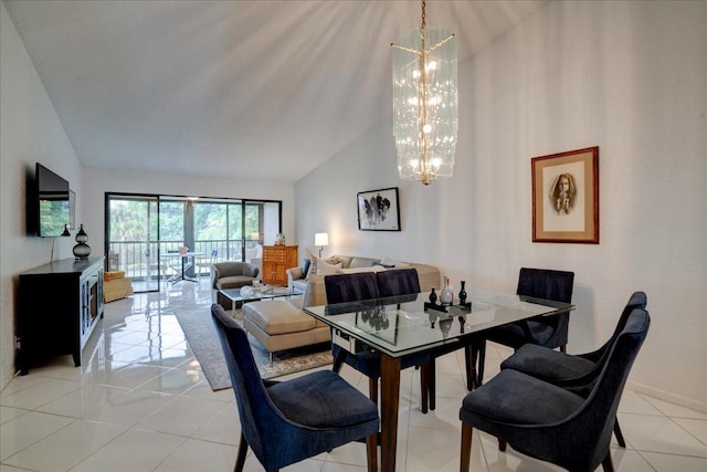 dining space with an inviting chandelier, light tile patterned flooring, and high vaulted ceiling