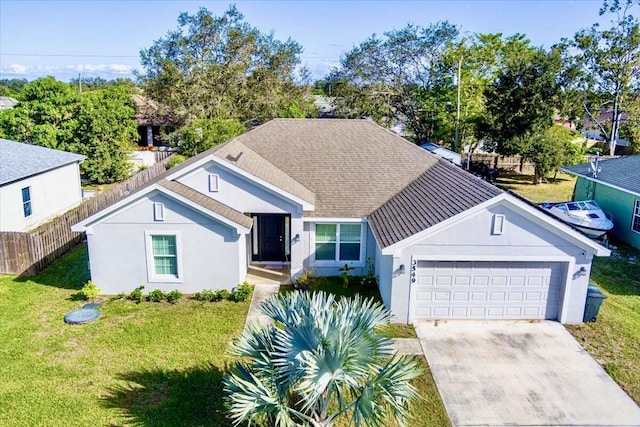 view of front facade featuring a front yard and a garage