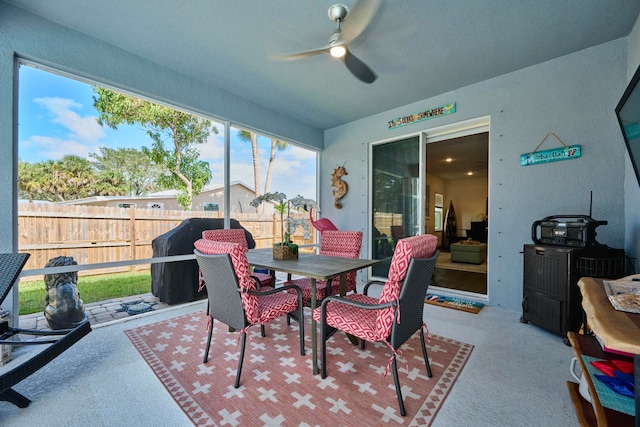 sunroom / solarium with ceiling fan