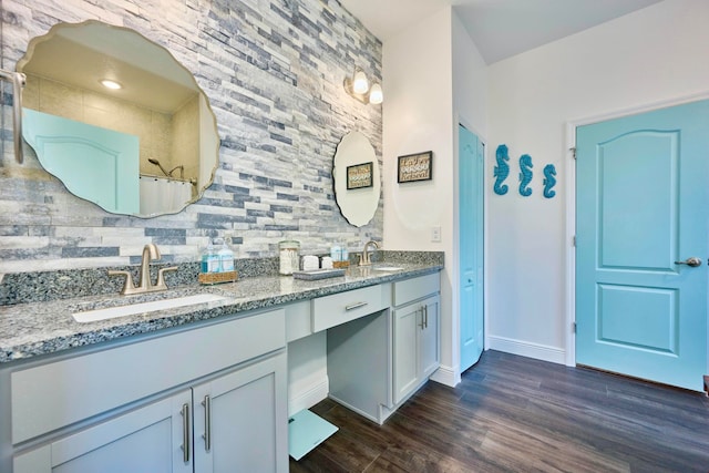 bathroom with curtained shower, decorative backsplash, hardwood / wood-style floors, and vanity