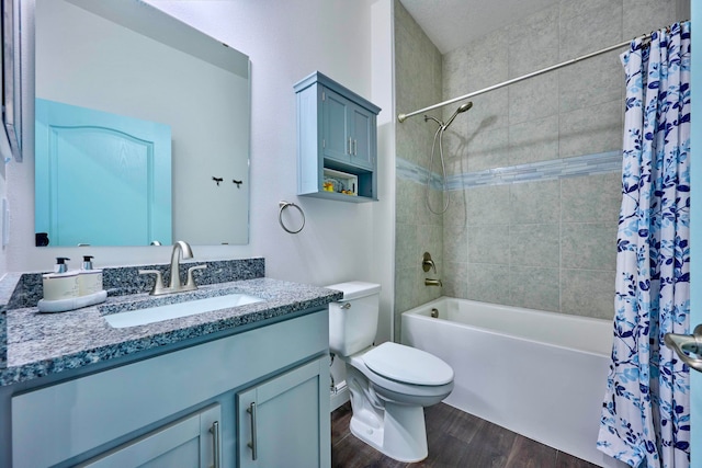 full bathroom featuring vanity, wood-type flooring, shower / tub combo, and toilet