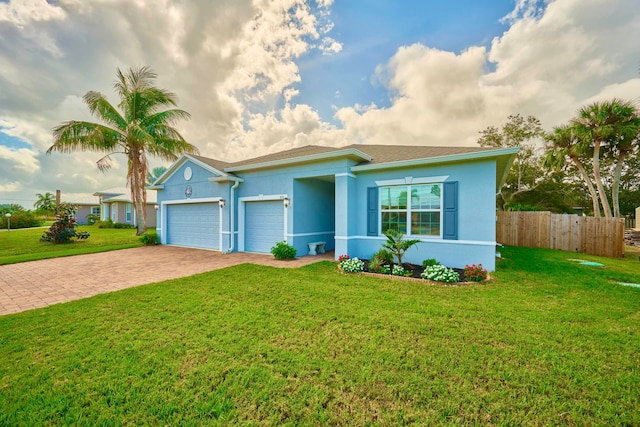 single story home with a garage and a front yard