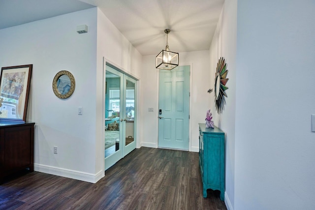 entryway with dark wood-type flooring and french doors