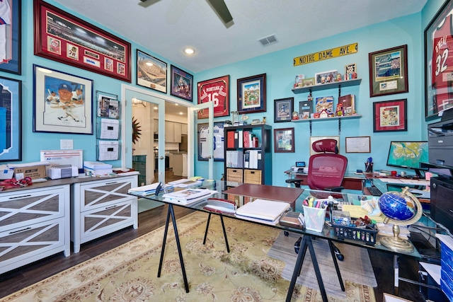 office space featuring hardwood / wood-style floors and ceiling fan