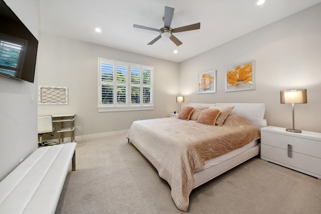 bedroom with light colored carpet and ceiling fan