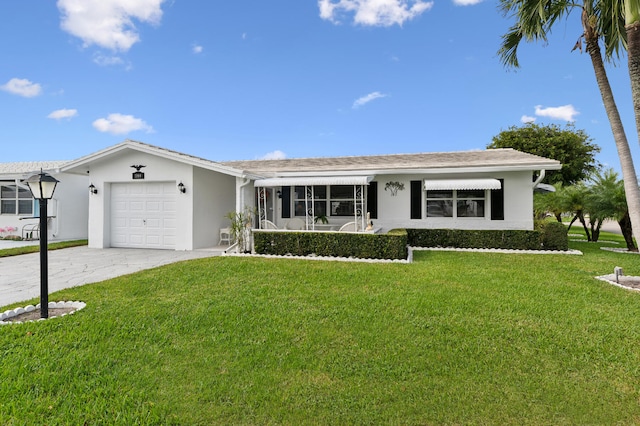 single story home with a front yard and a garage