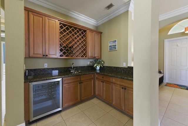 2233 SW Golden Bear Way, Palm City, FL 34990 - indoor wet bar featuring beverage cooler, light tile patterned floors, and ornamental molding