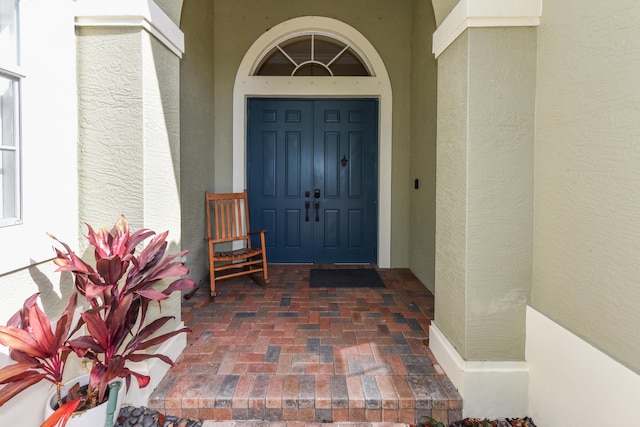2233 SW Golden Bear Way, Palm City, FL 34990 - property entrance with stucco siding
