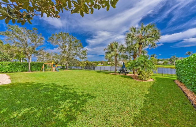 2233 SW Golden Bear Way, Palm City, FL 34990 - view of yard featuring a playground and a water view